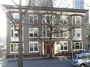 image of the brown three story apartment looking Bishop Lewis Reentry Center.