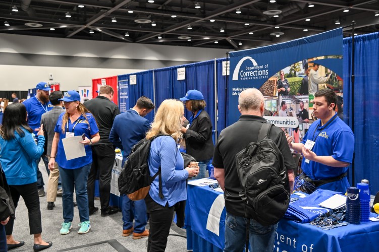 group of people talking at vendor event