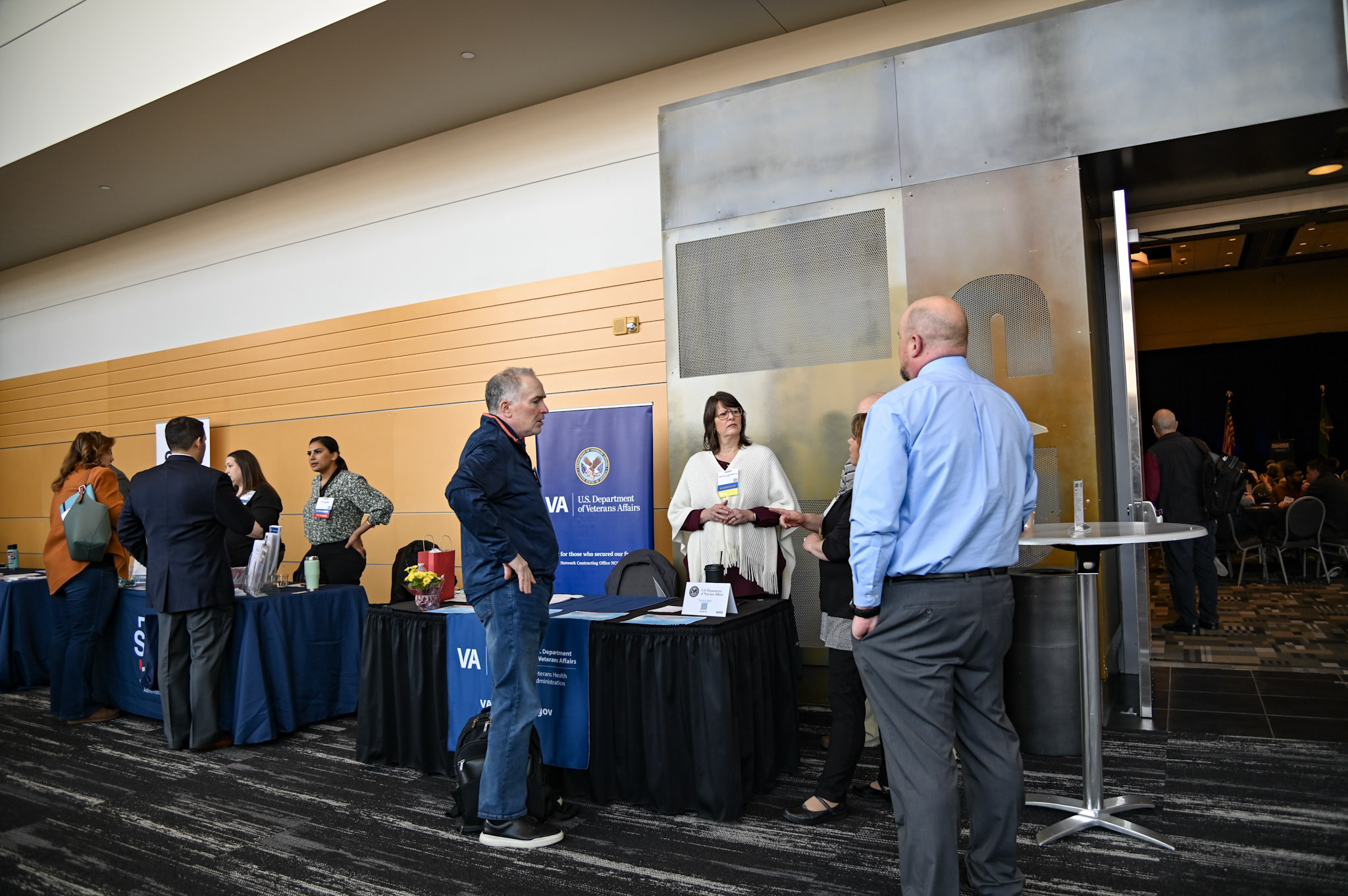 group of people listening to vendor speak