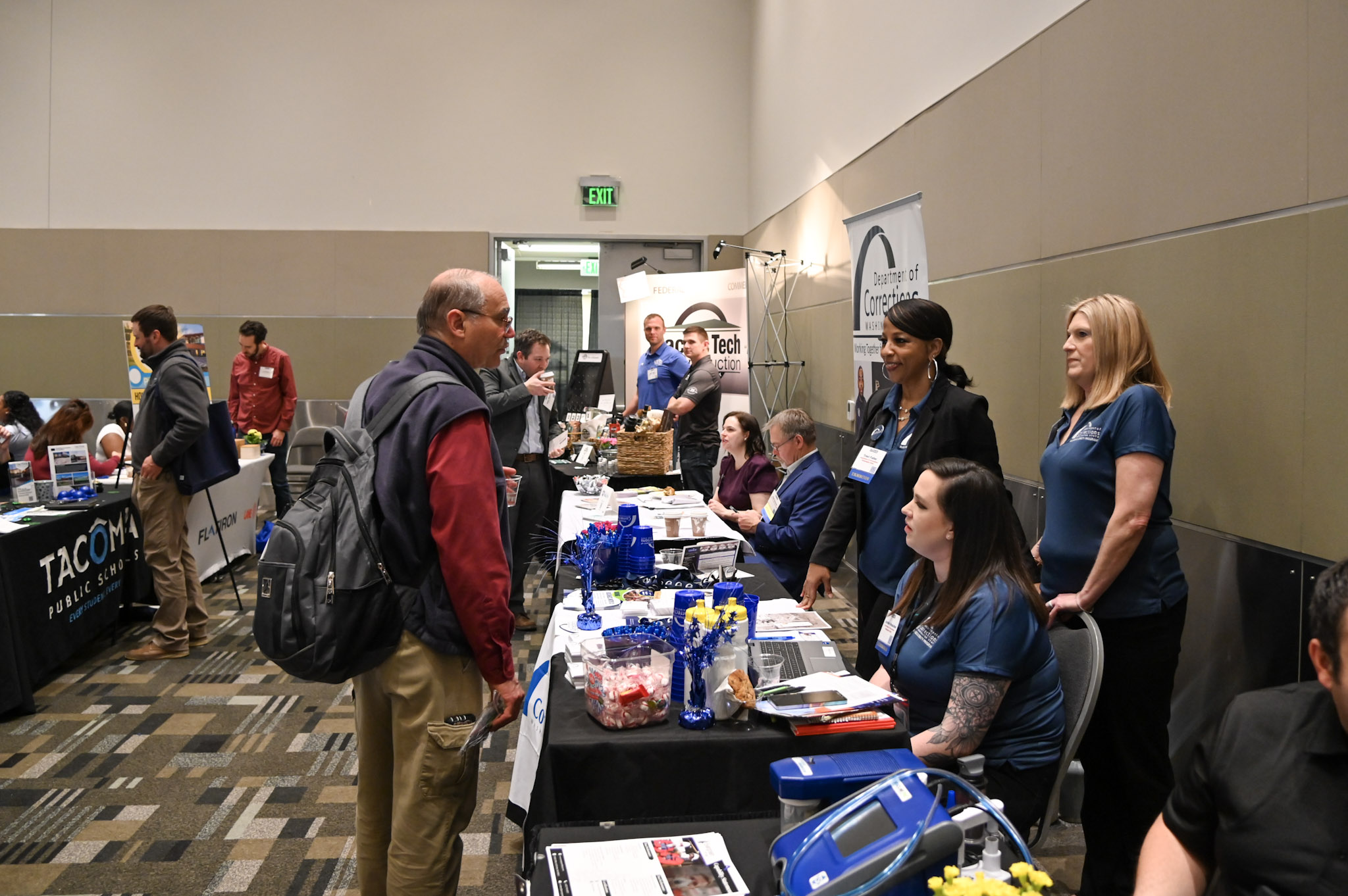 group of people listening to vendor speak