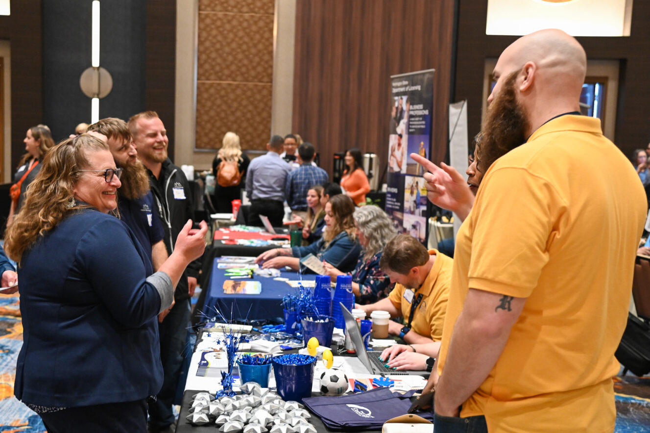 group of people talking at vendor event