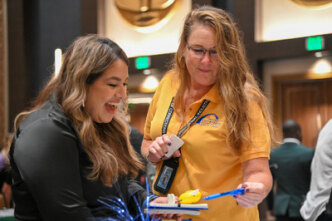 two people talking at vendor event