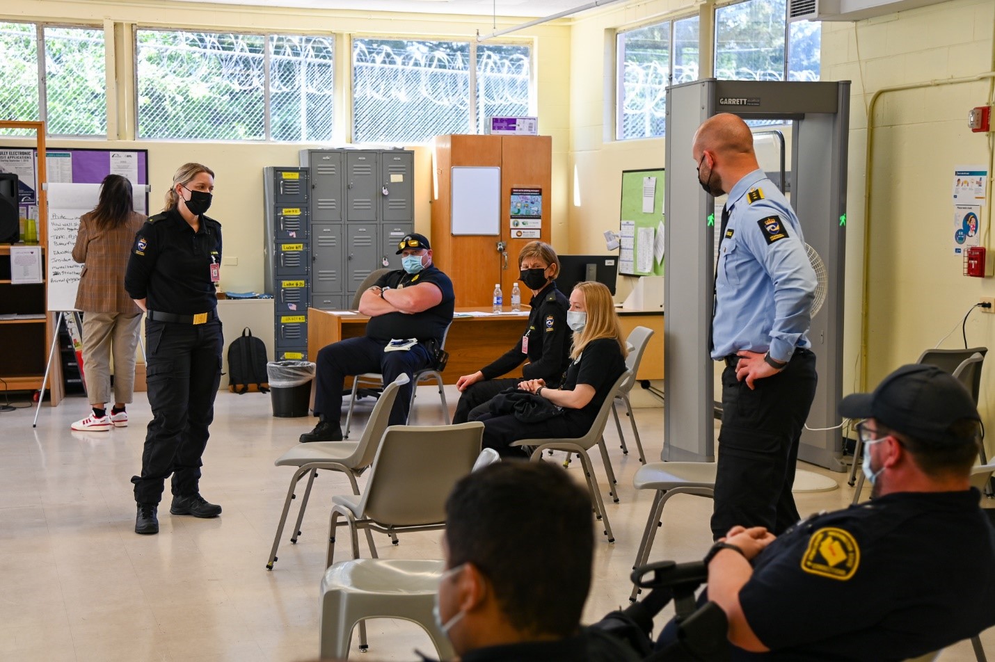 image of instructor and officers sitting in chairs