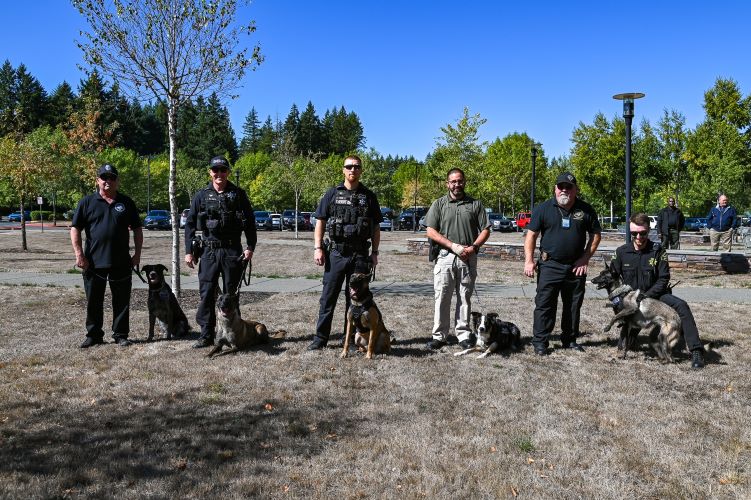 Handlers posed with their canines