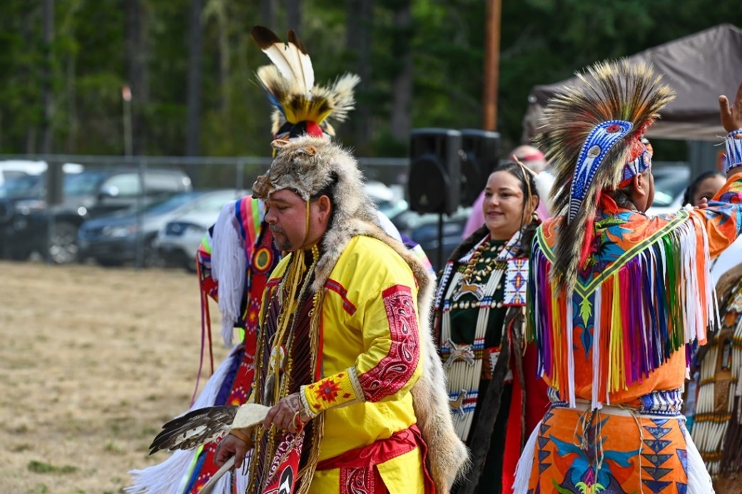 incarcerated indigenous individuals dancing in native american ceremony