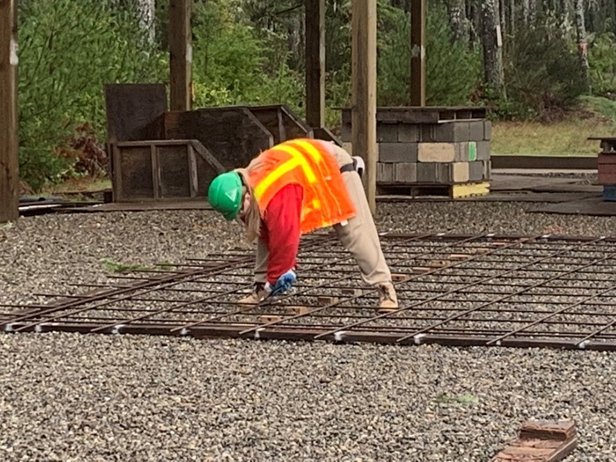 Incarcerated Individual works with rebar
