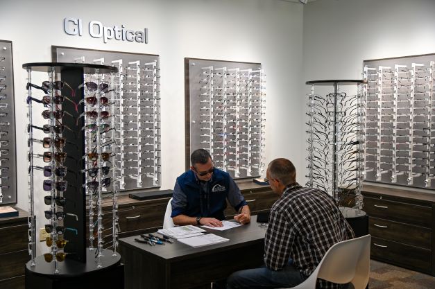 two men sitting down ordering eyeglasses