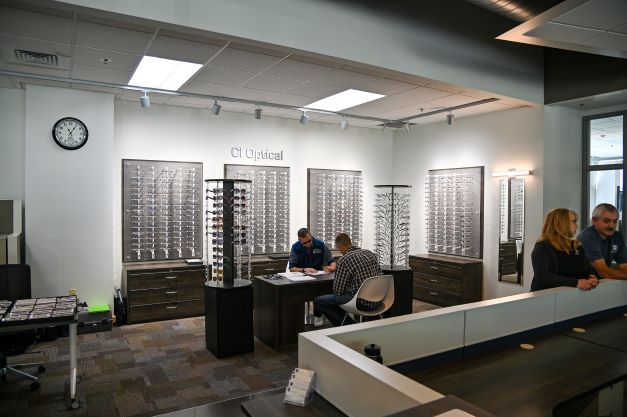 two men sitting down ordering eyeglasses