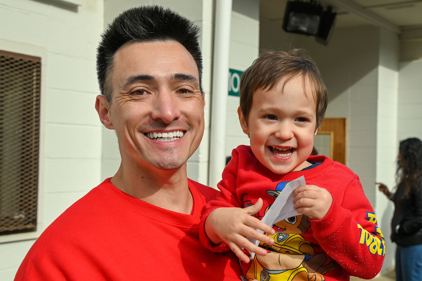 Father and son smiling