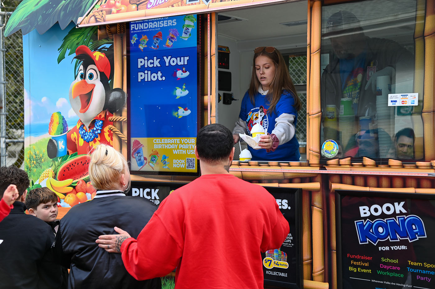 Family getting enjoying the Kona Ice Truck