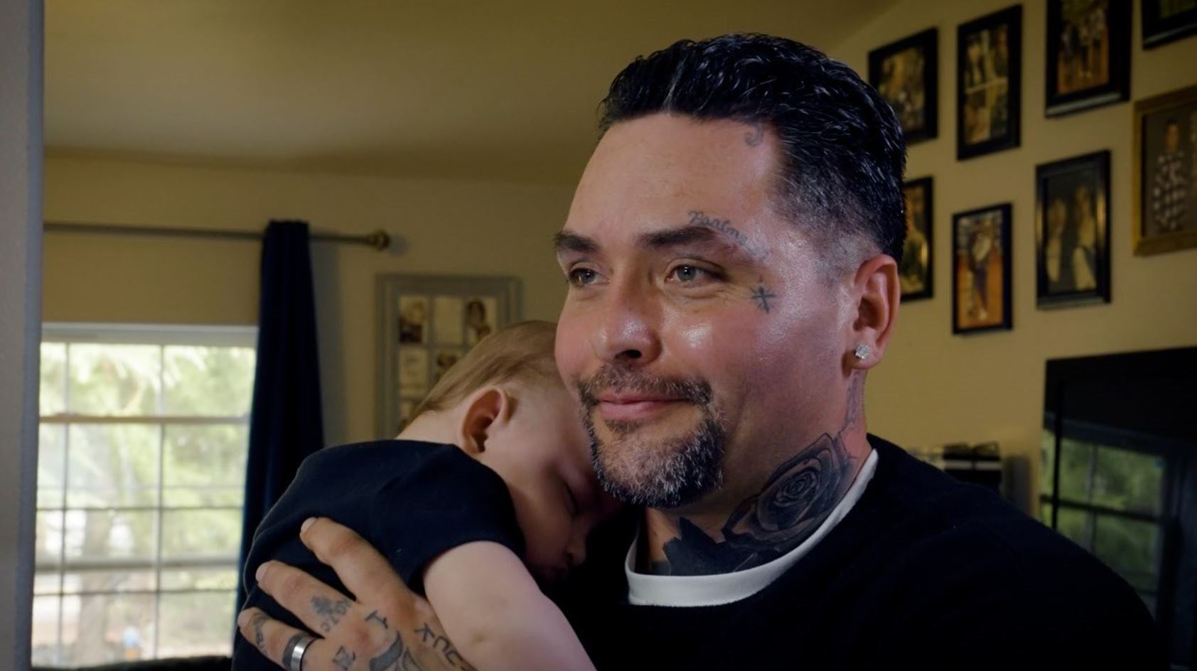 GRE participant with his child.